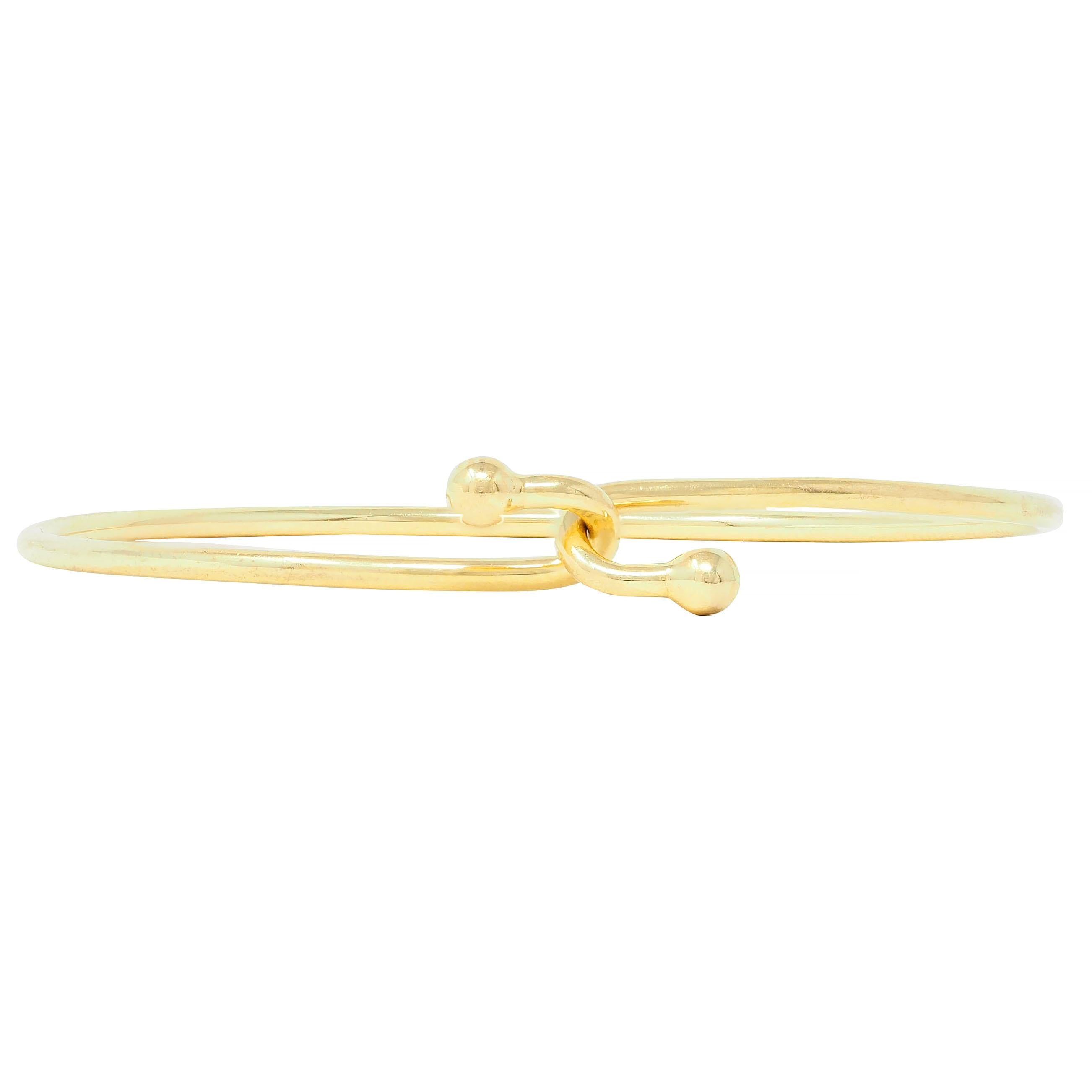 Tiffany & Co. 2000's 18 Karat Yellow Gold Interlocking Hook Bangle Bracelet