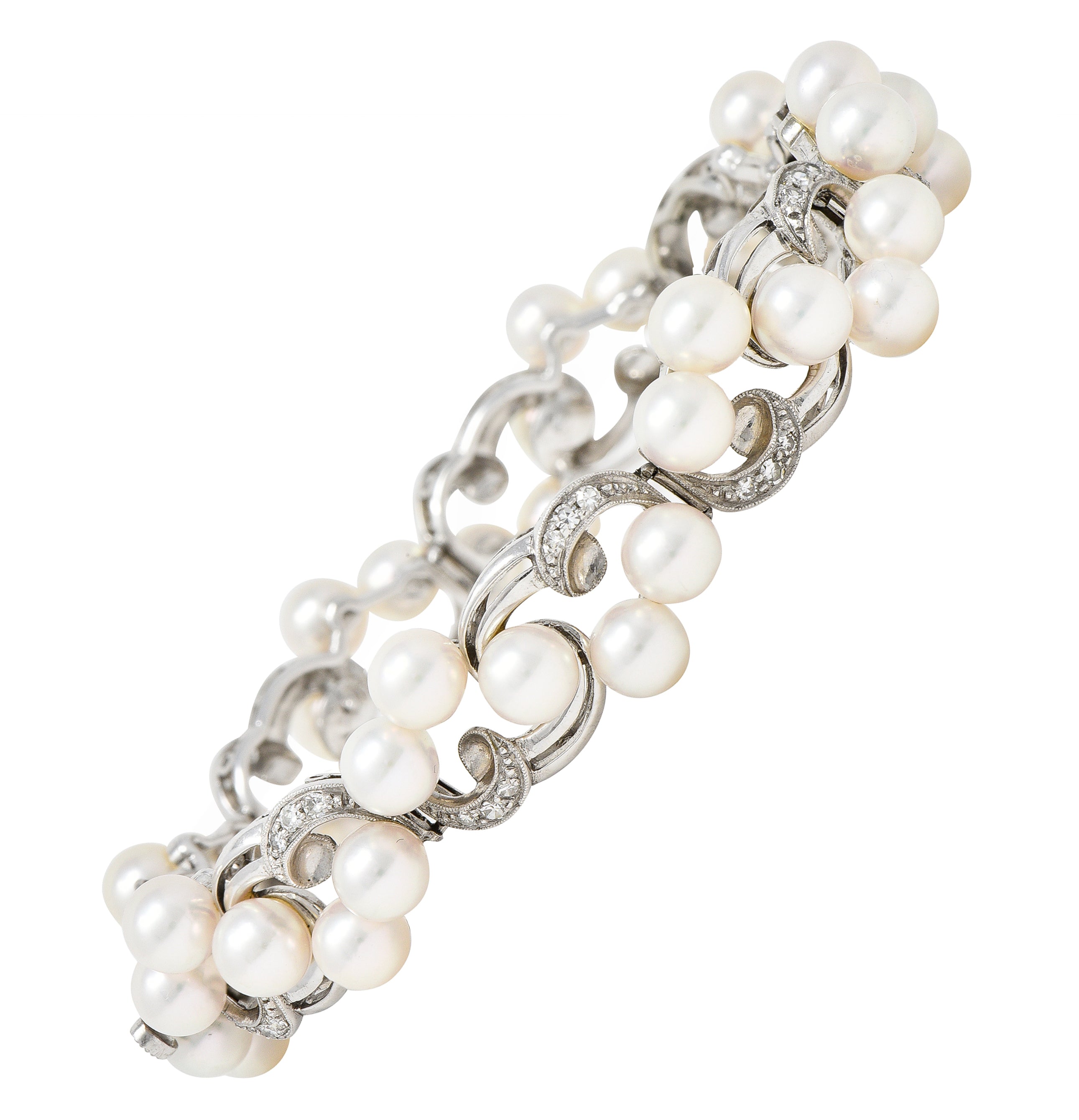 Mikimoto Mid-Century Diamond Cultured Pearl 14 Karat White Gold Scrolling Ribbon Vintage Bracelet Wilson's Estate Jewelry