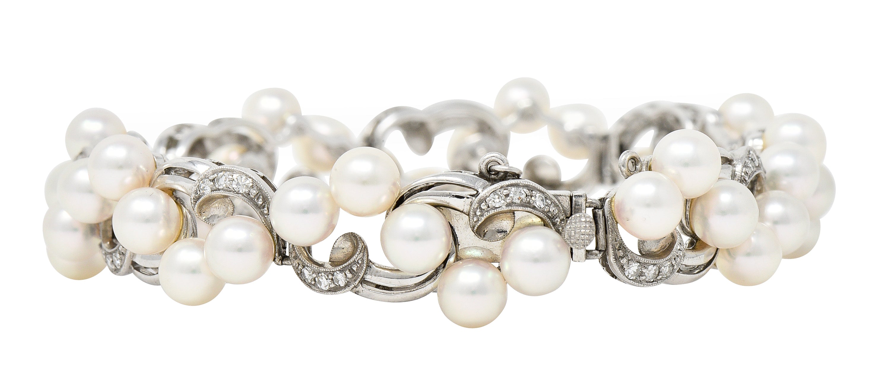 Mikimoto Mid-Century Diamond Cultured Pearl 14 Karat White Gold Scrolling Ribbon Vintage Bracelet Wilson's Estate Jewelry