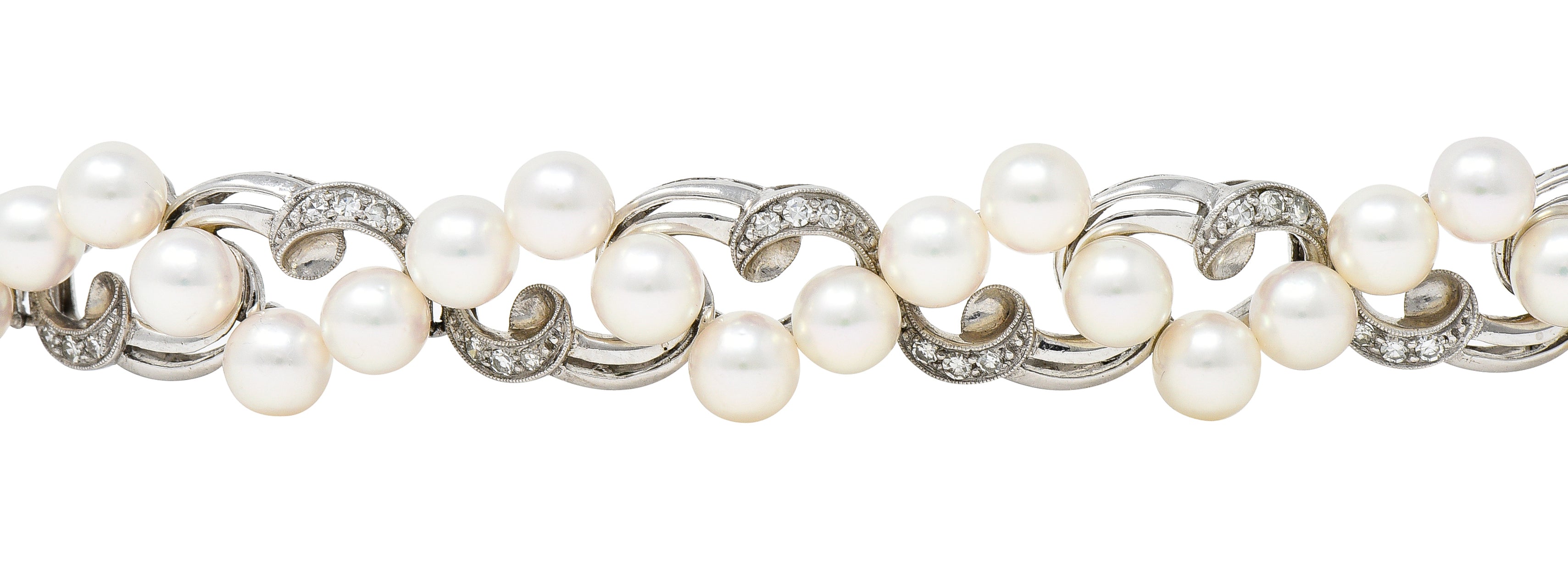 Mikimoto Mid-Century Diamond Cultured Pearl 14 Karat White Gold Scrolling Ribbon Vintage Bracelet Wilson's Estate Jewelry