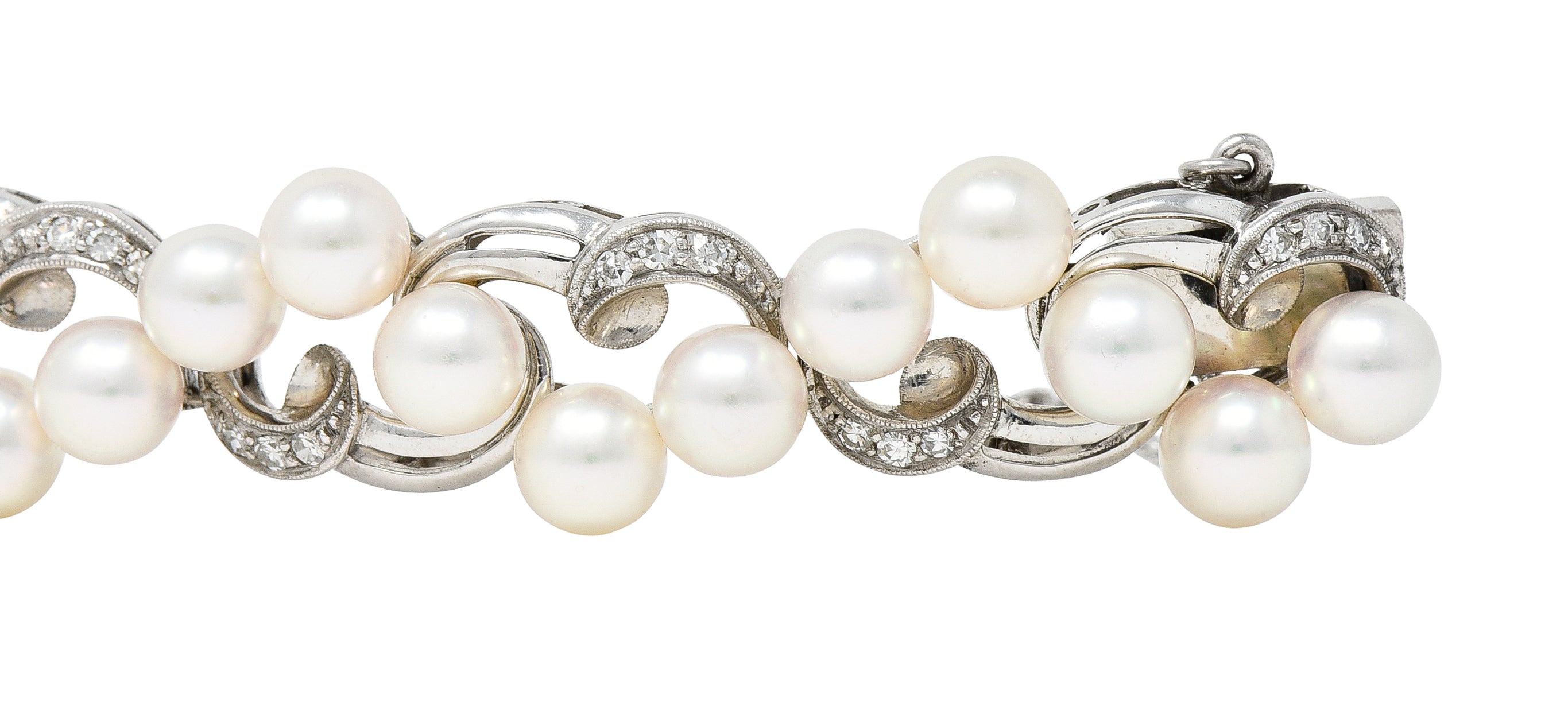 Mikimoto Mid-Century Diamond Cultured Pearl 14 Karat White Gold Scrolling Ribbon Vintage Bracelet Wilson's Estate Jewelry