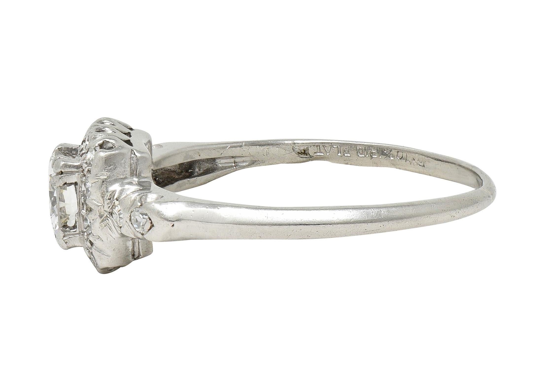 Mid-Century 0.62 CTW Diamond Platinum Halo Vintage Engagement Ring