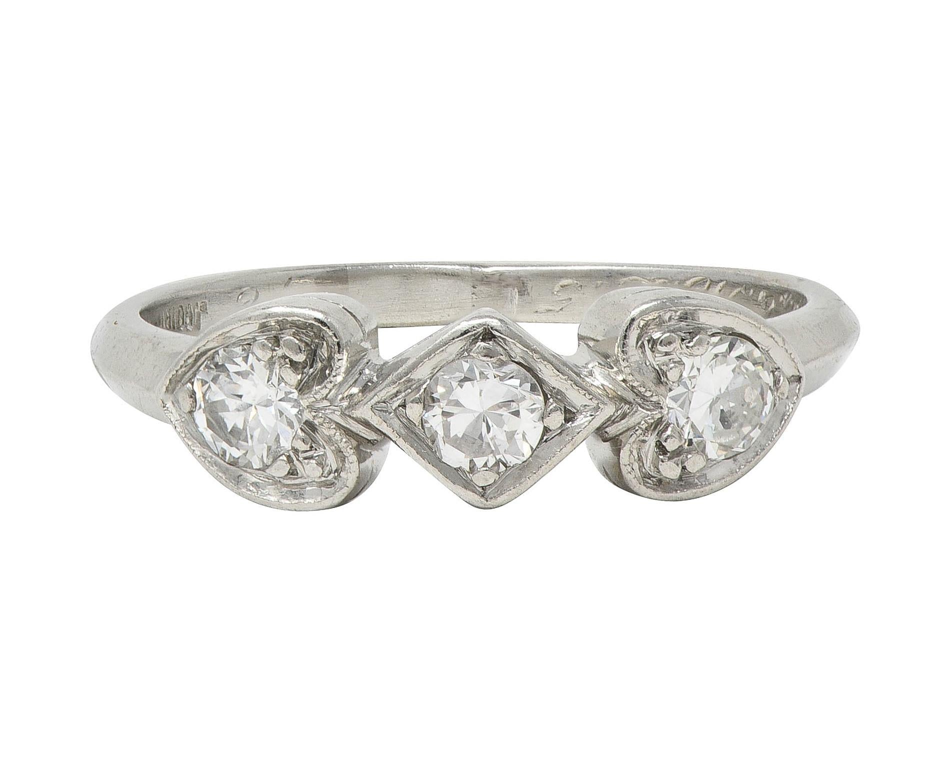 Mid-Century 0.32 CTW Diamond Platinum Heart Three Stone Vintage Band Ring