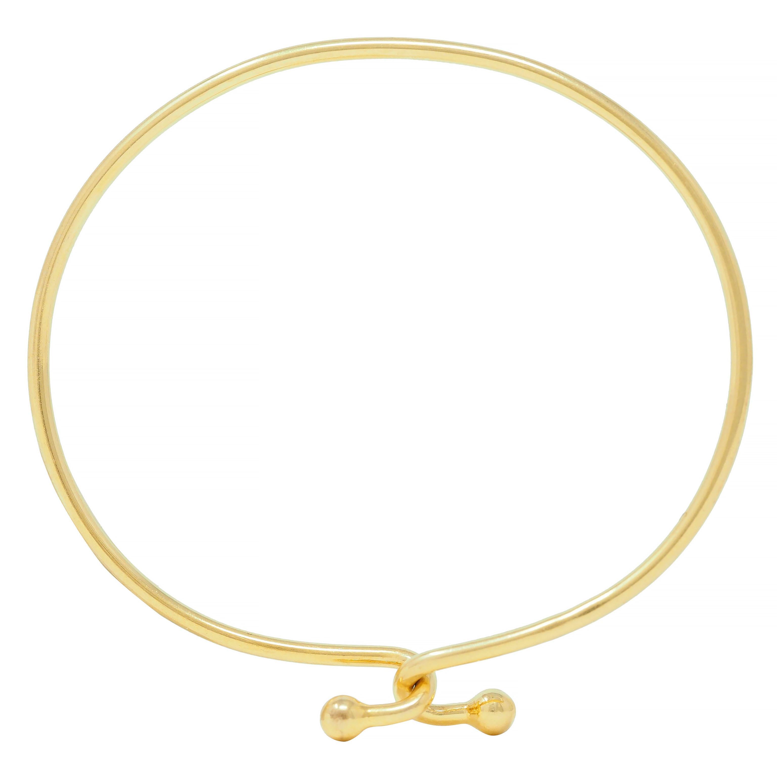 Tiffany & Co. 2000's 18 Karat Yellow Gold Interlocking Hook Bangle Bracelet