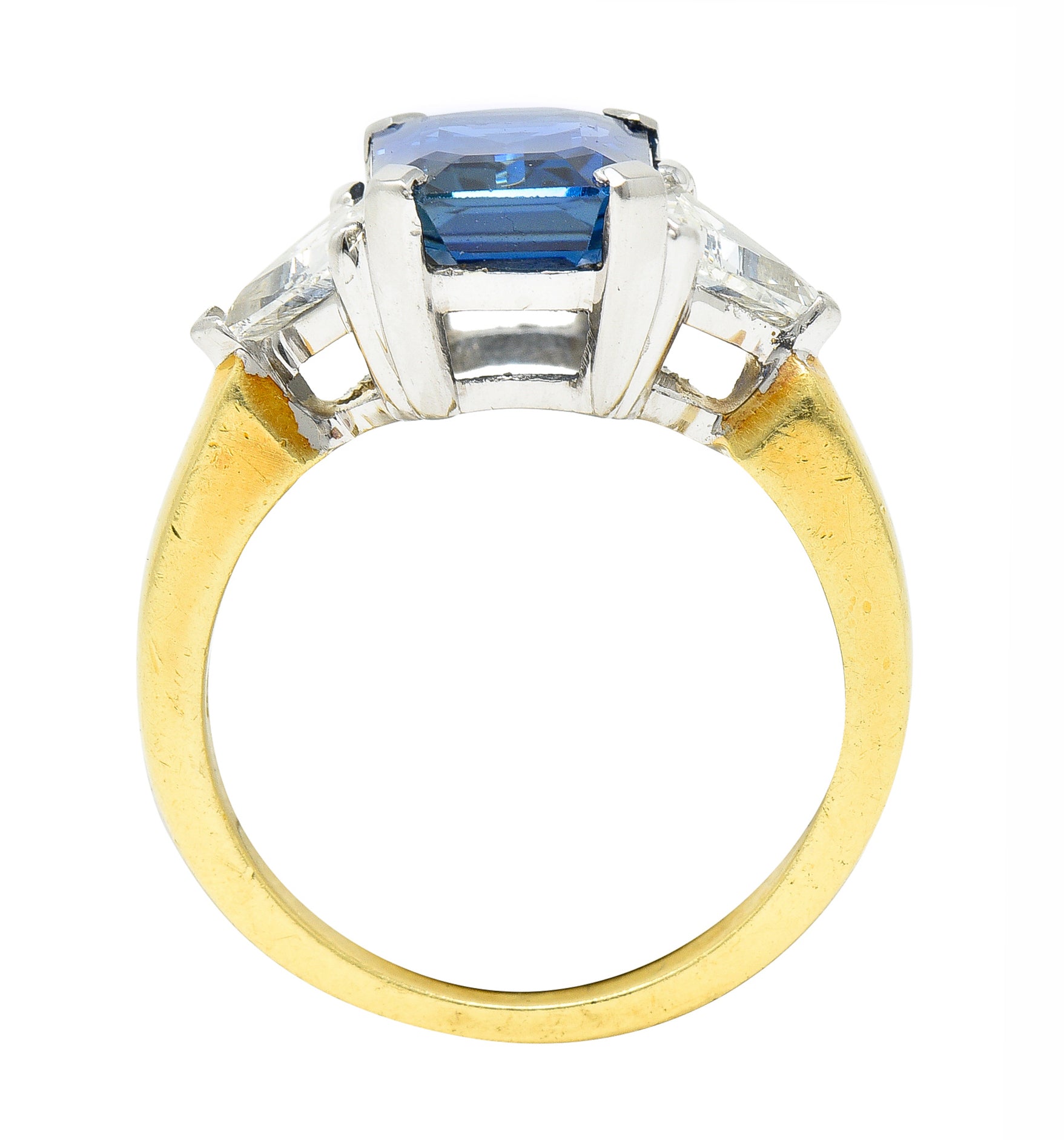 .11111 ## IS THIS A BETTER EDIT?SL 1980's 4.00 CTW Emerald Cut Sapphire Trillion Cut Diamond Platinum 18 Karat Yellow Gold Vintage Three Stone Ring Wilson's Estate Jewelry