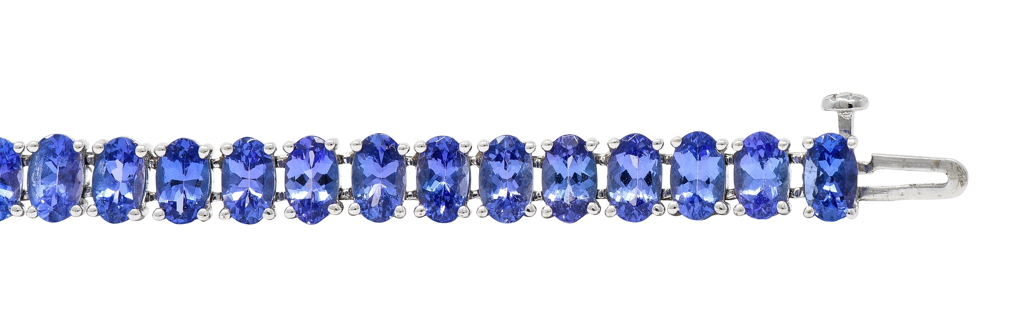 Contemporary 12.00 CTW Oval Cut Tanzanite 14 Karat White Gold Line Bracelet Wilson's Estate Jewelry