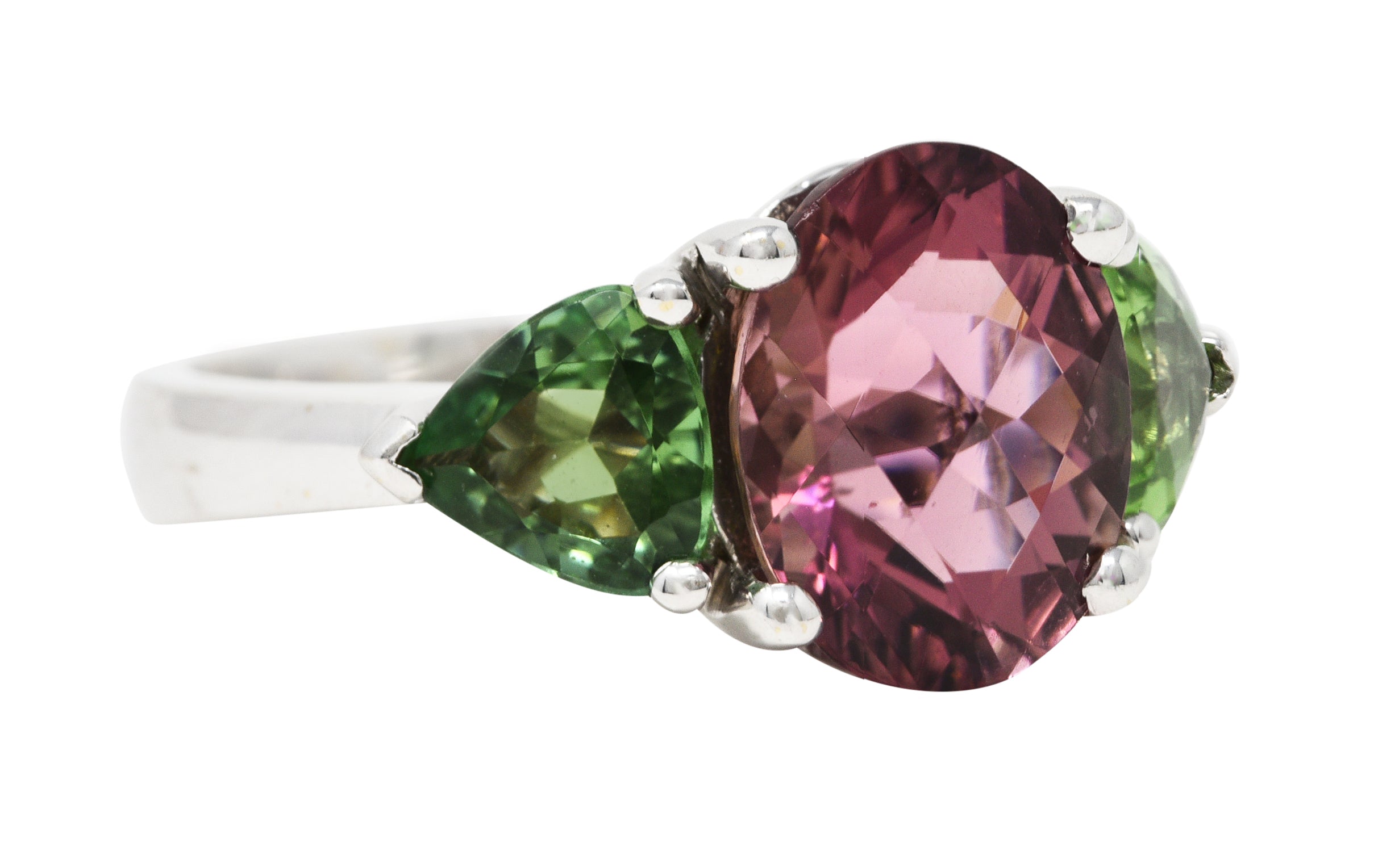 Contemporary 7.23 CTW Oval Cut Pink Tourmaline Peridot 18 Karat White Gold Three Stone Ring Wilson's Estate Jewelry