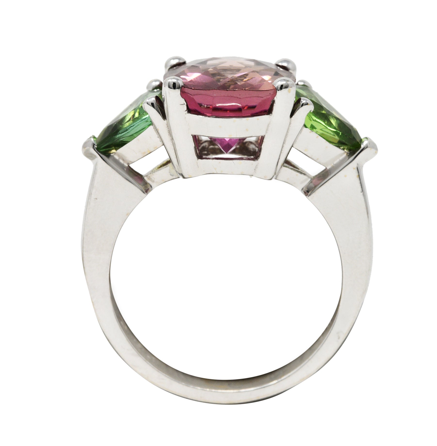 Contemporary 7.23 CTW Oval Cut Pink Tourmaline Peridot 18 Karat White Gold Three Stone Ring Wilson's Estate Jewelry