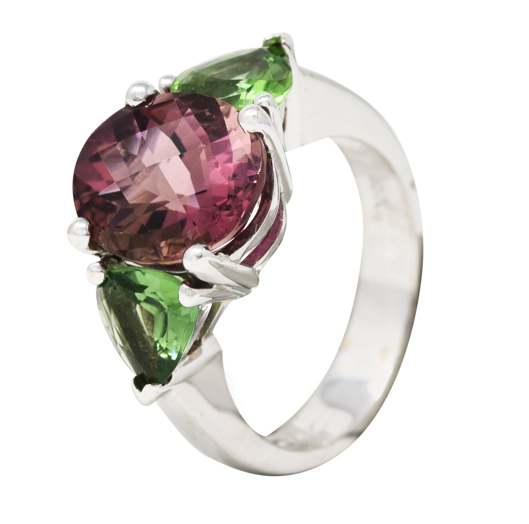 Contemporary 7.23 CTW Oval Cut Pink Tourmaline Peridot 18 Karat White Gold Three Stone Ring Wilson's Estate Jewelry