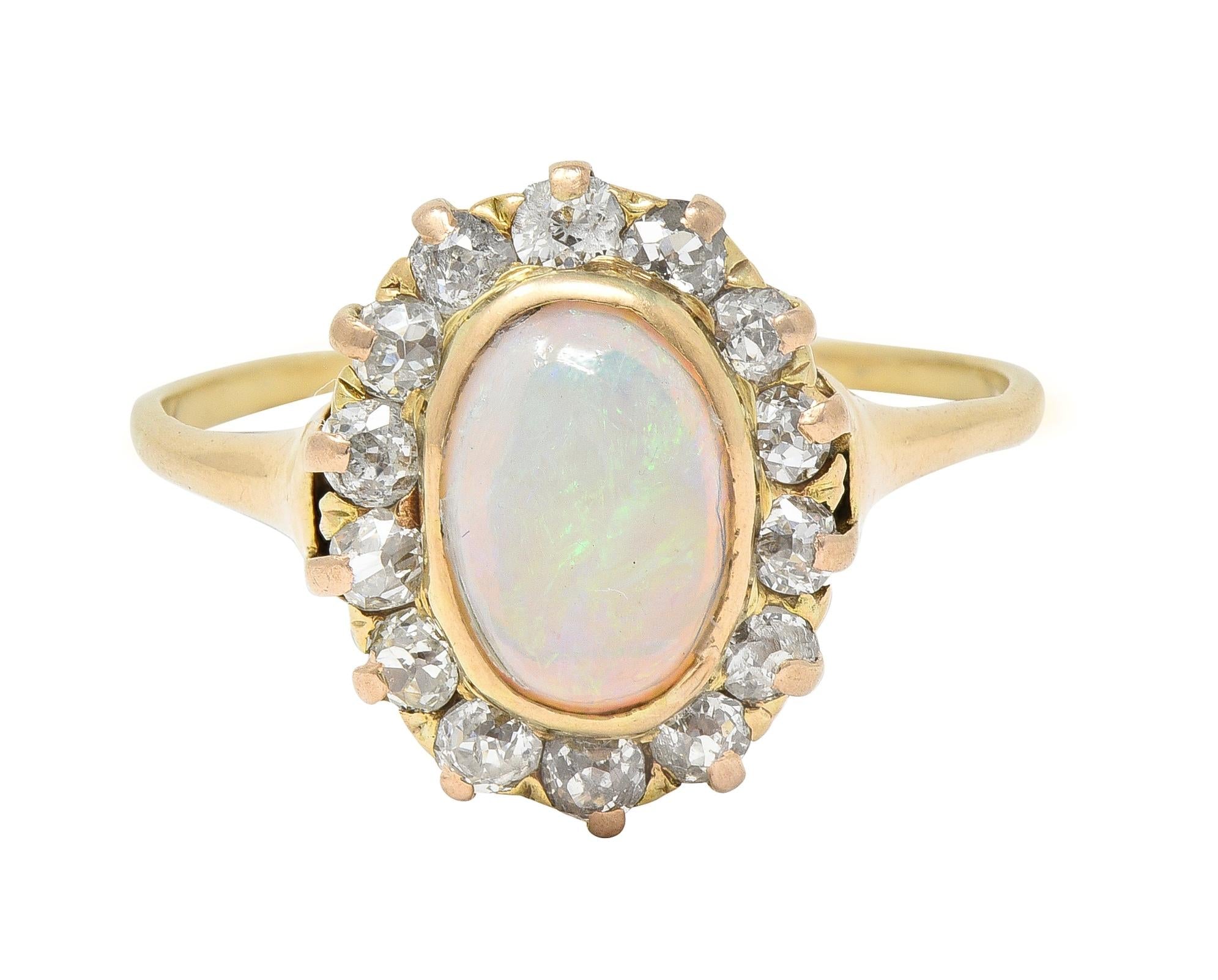 Victorian 0.86 CTW Opal Cabochon Diamond 14 Karat Yellow Gold Antique Halo Ring