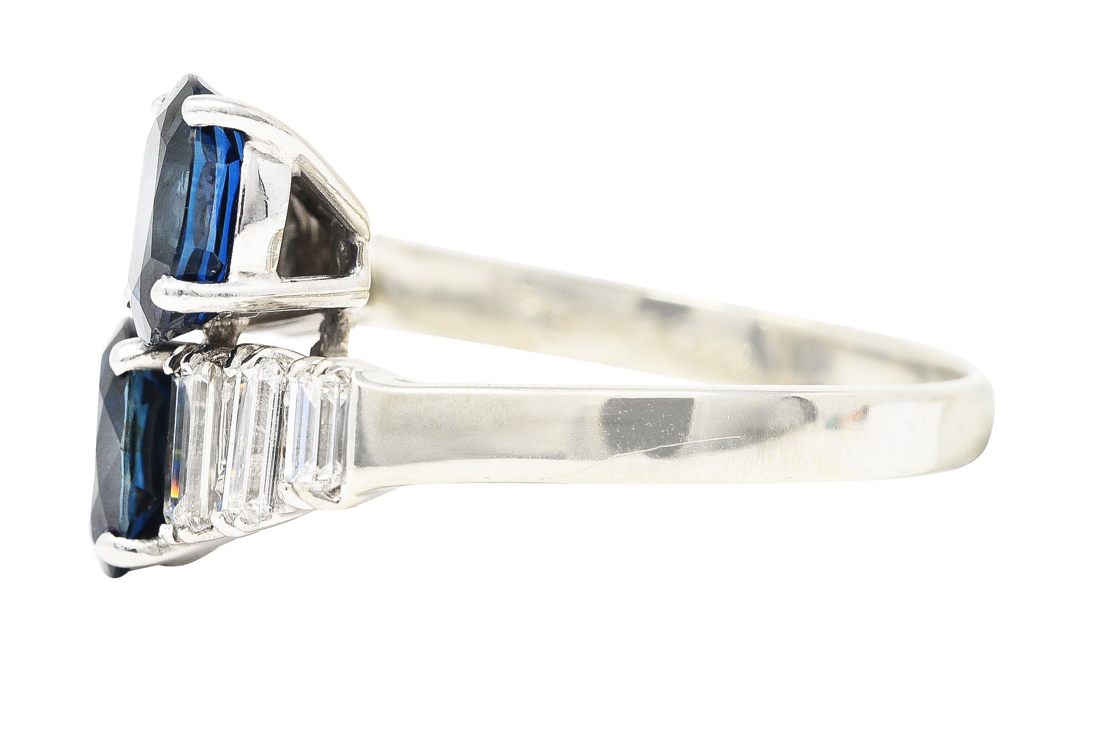 Vintage 3.54 CTW Oval Cut Sapphire Baguette Cut Diamond 18 Karat White Gold Bypass Ring Wilson's Estate Jewelry