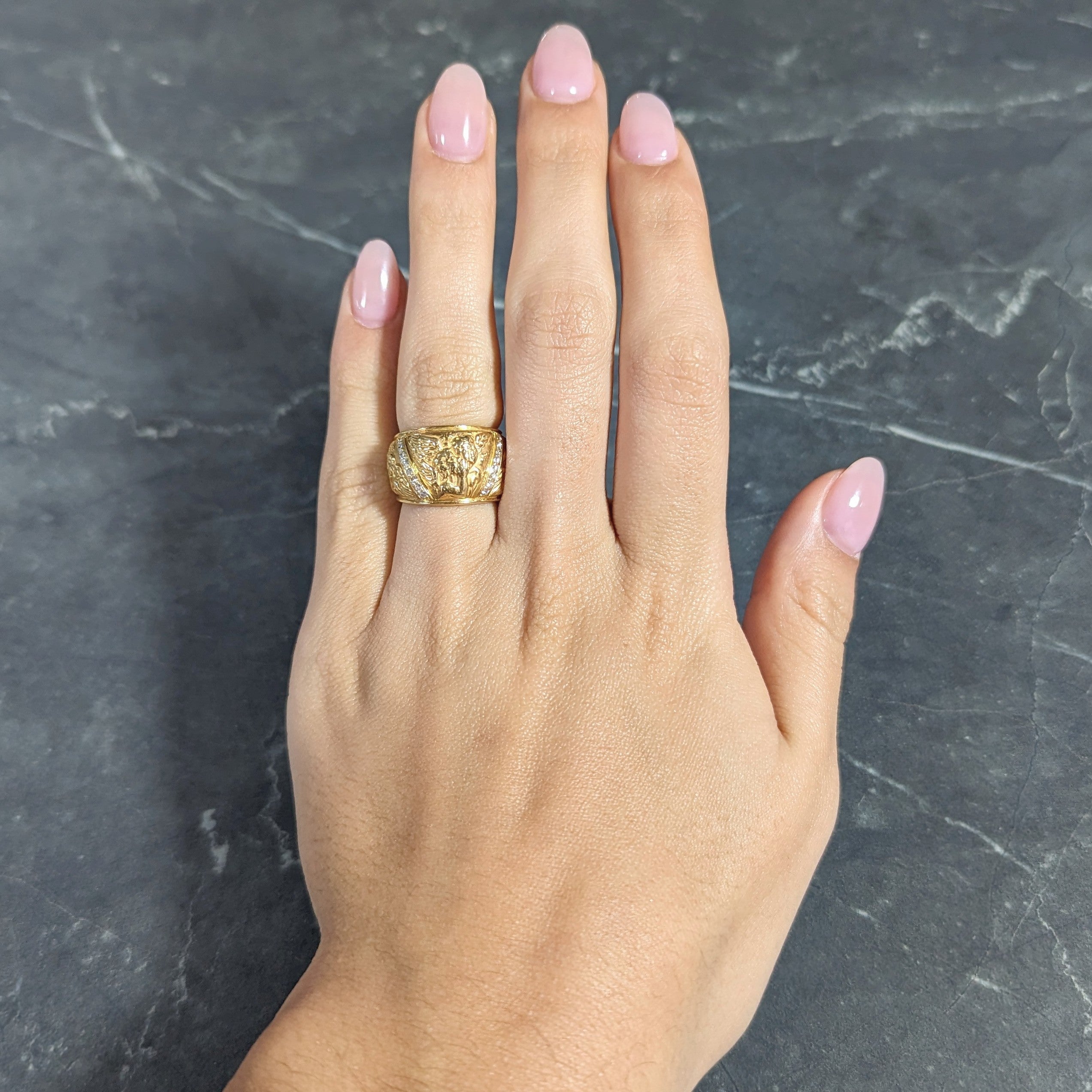 Carrera y Carrera 1990's 18 Karat Yellow Gold Repoussé Cherub Vintage Band Ring Wilson's Estate Jewelry