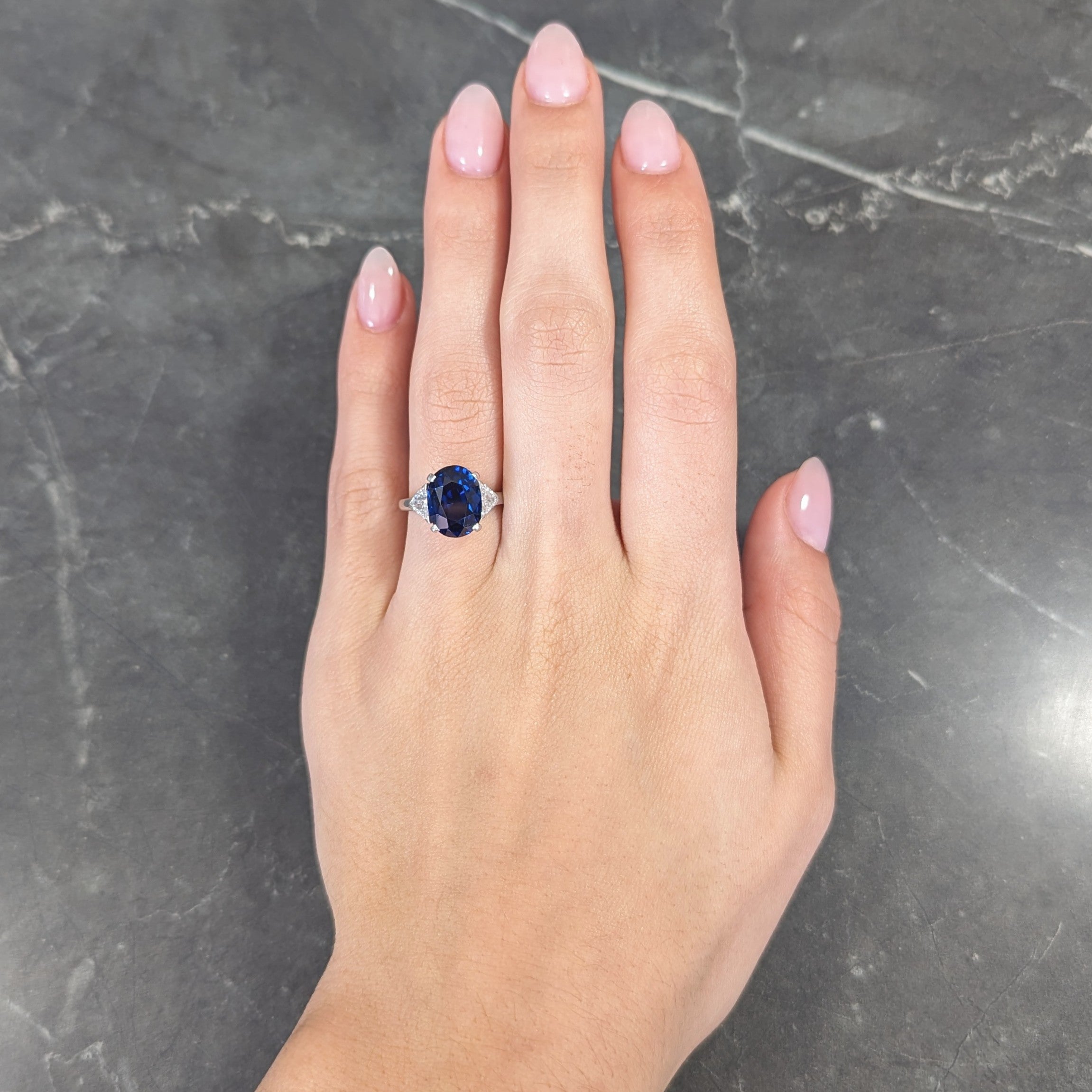 Mid-Century 7.13 CTW Oval Cut No-Heat Thai Sapphire Trillion Cut Diamond Platinum Vintage Three Stone Ring GIA Wilson's Estate Jewelry