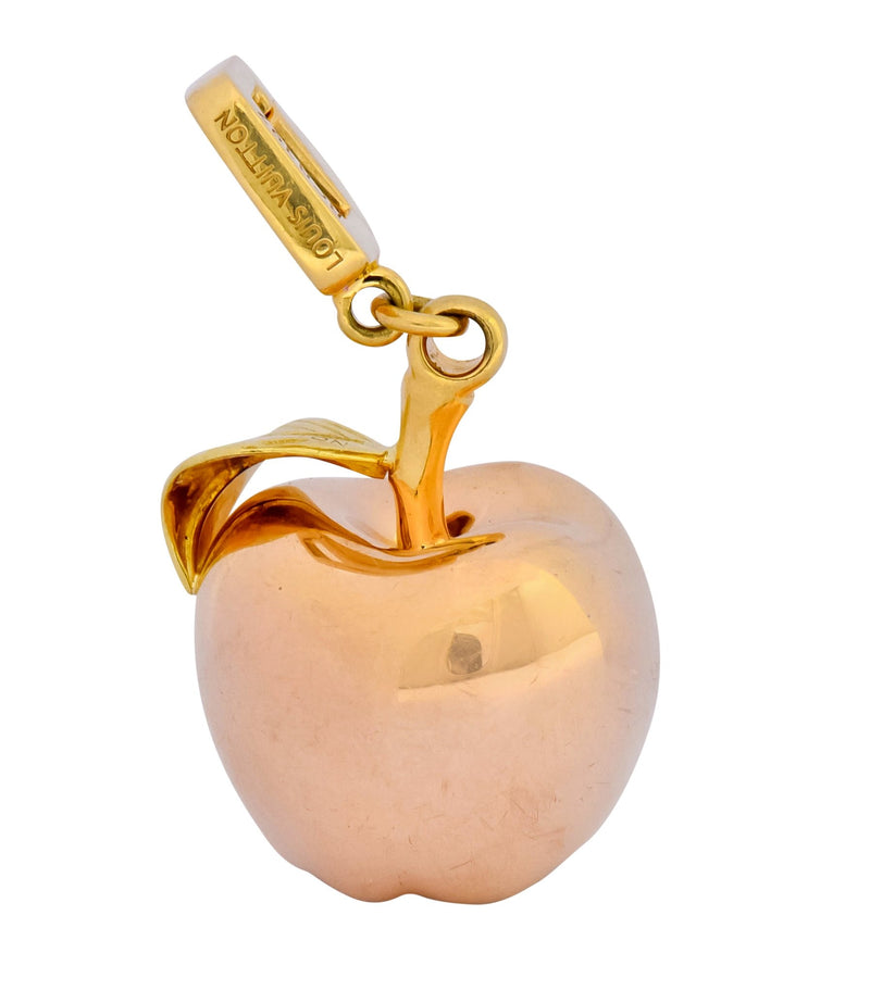 Louis Vuitton. Apple charm in gold 750, signed and numbe…